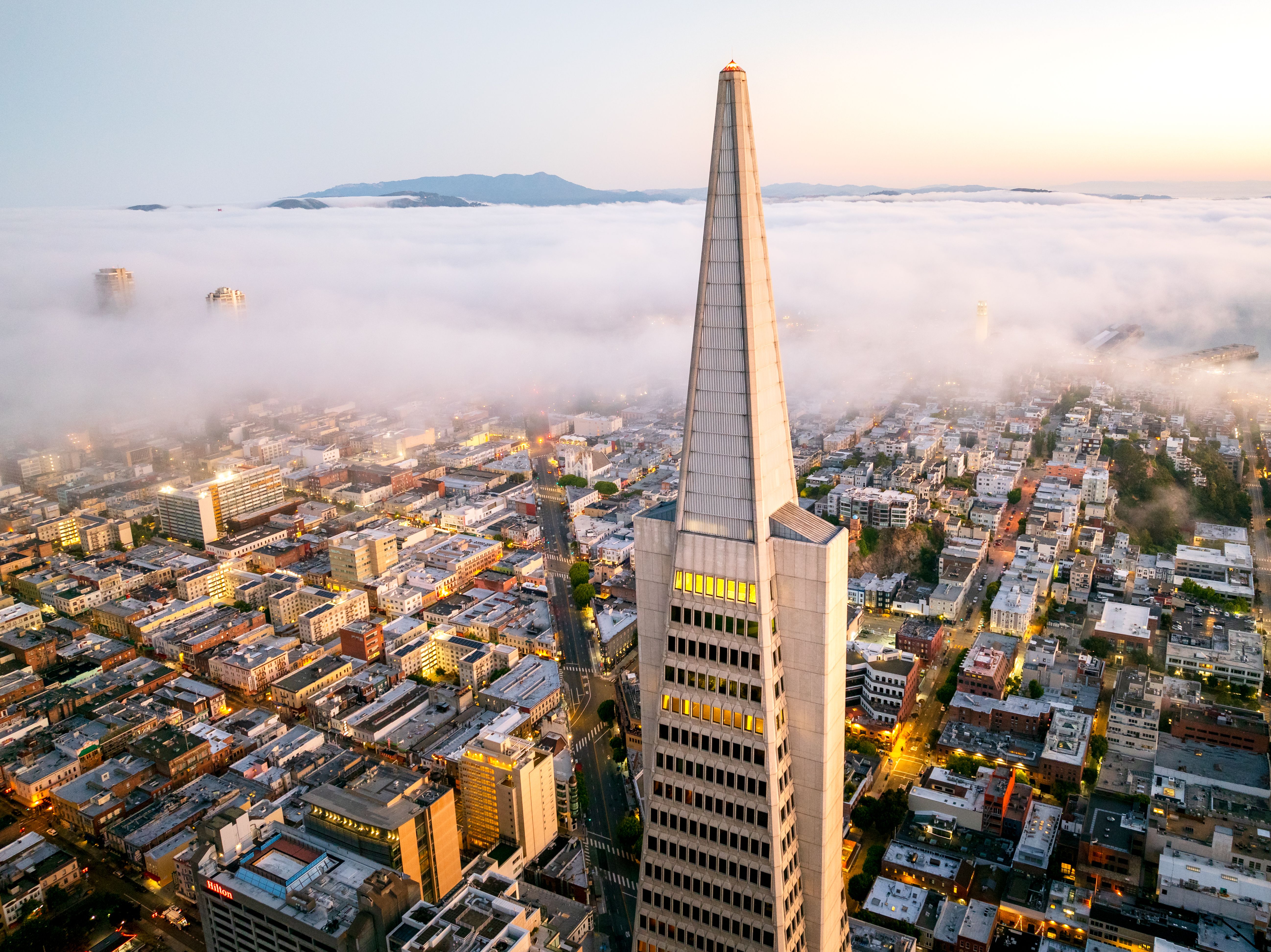 Aerial view of San Francisco with fog and Transamerica Pyramid